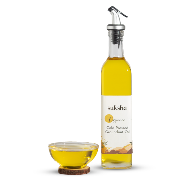 Organic Cold Pressed Groundnut Oil bottle and Bowl.
